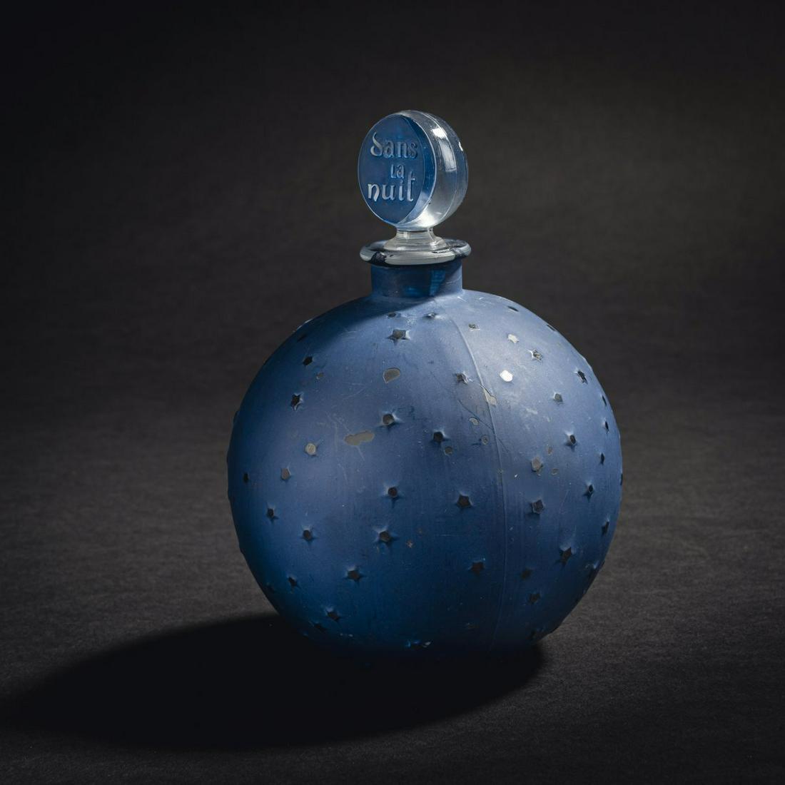 René Lalique, Bottle 'Dans la Nuit' for Worth,: René Lalique, Bottle 'Dans la Nuit' for Worth, 1924., H. 13.5 cm. Clear mould-blown glass, dark blue patina. Signed: FRENCH BOTTLE 350 ml NA CREATION R. LALIQUE (raised)., Marcilhac, René