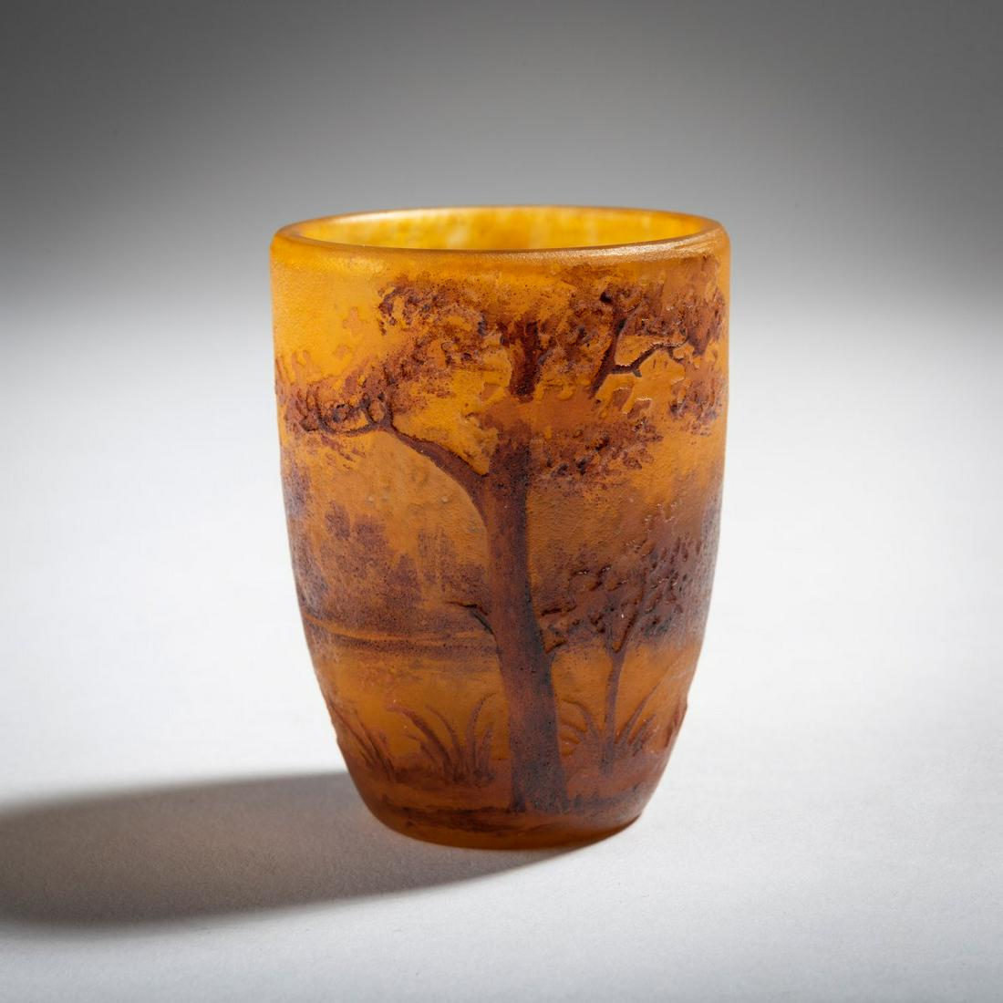 Daum Frères, Nancy, Miniature vase 'Paysage', c.: Daum Frères, Nancy, Miniature vase 'Paysage', c. 1910, H. 5.1 cm. Overlaid glass, clear, orange-yellow powder inclusions, red enamel melts. Etched decor heightened with black solder, motif of a