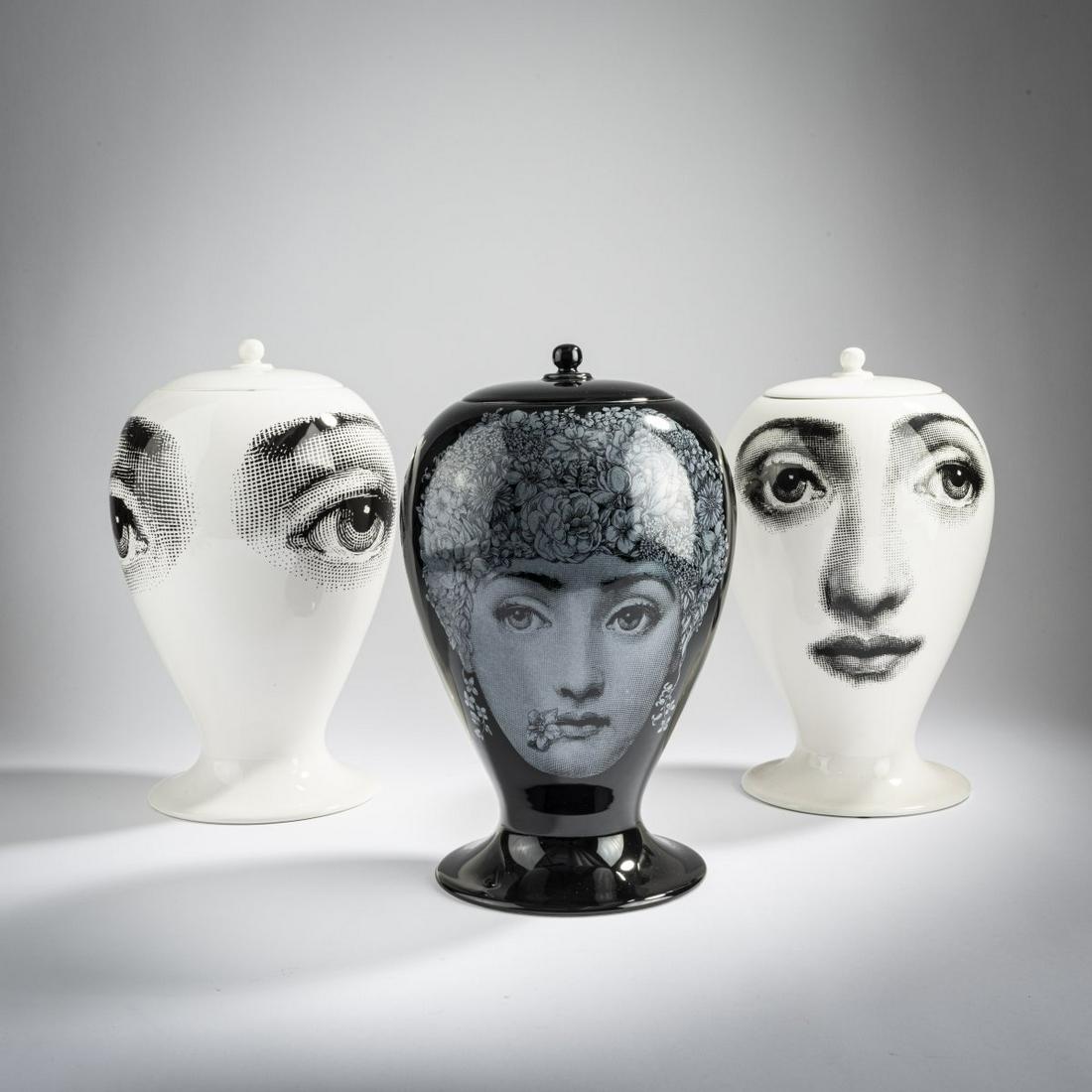 Piero Fornasetti; Barnaba Fornasetti, Three vases with: Piero Fornasetti; Barnaba Fornasetti, Three vases with lids 'Tema E Variazioni', 2000s, H. 28.5 cm. Made by Bitossi, Montelupo for Fornasetti, Milan. Earthenware, glazed white and black, transfer deco
