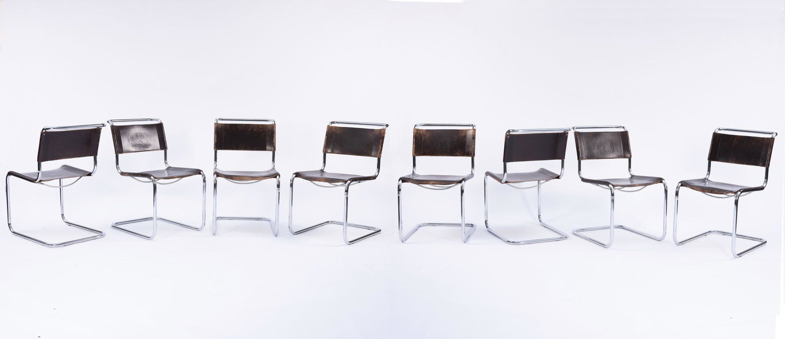Marcel Breuer, Eight 'B 33' chairs, 1927/28: Marcel Breuer, Eight 'B 33' chairs, 1927/28, H. 84.5 x 50 x 68 cm; Tube: Ø 2.4 cm. Made by Thonet, Frankenberg, 1930s. Tubular steel, chrome-plated, plugged, brown leather; two spreader bars wi