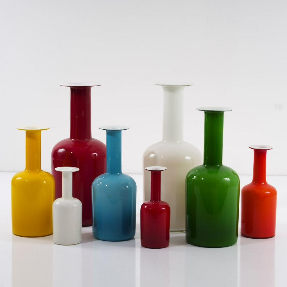 Otto Brauer, Eight vases, 1950s: Otto Brauer, Eight vases, 1950s, H. 24.2-51.5 cm. Made by Holmegaard Glasvaerk, Copenhagen. Glass, clear, opal white, red, orange, yellow and light blue. Marked: manufacturer's label (2x).,