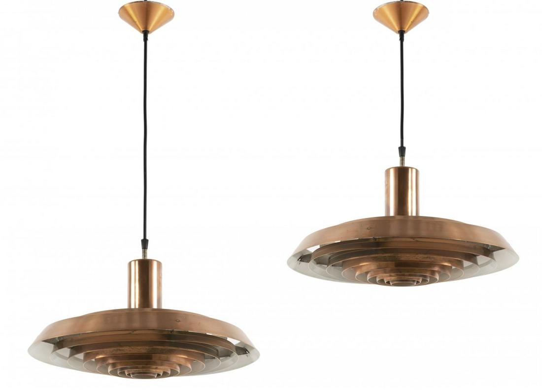 Poul Henningsen, Two 'Langelinie' pendant lights,: Poul Henningsen, Two 'Langelinie' pendant lights, 1957/58, H. 22 cm, D. 43 cm. Made by Louis Poulsen, Copenhagen. Sheet aluminium, copper-plated, partially varnished white., Jörstian/Nielsen (ed.