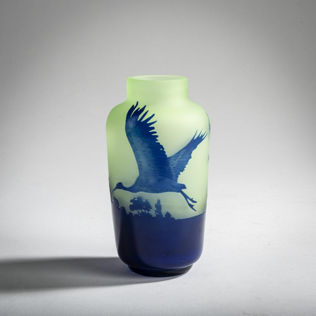 Paul Nicolas, Nancy, 'Grues' vase, 1918-20: Paul Nicolas, Nancy, 'Grues' vase, 1918-20, H. 11.3 cm. Overlaid glass, colourless, lemon yellow and dark blue. Decor etched in several steps, flying cranes over a city silhouette. Signed: P. Nicolas