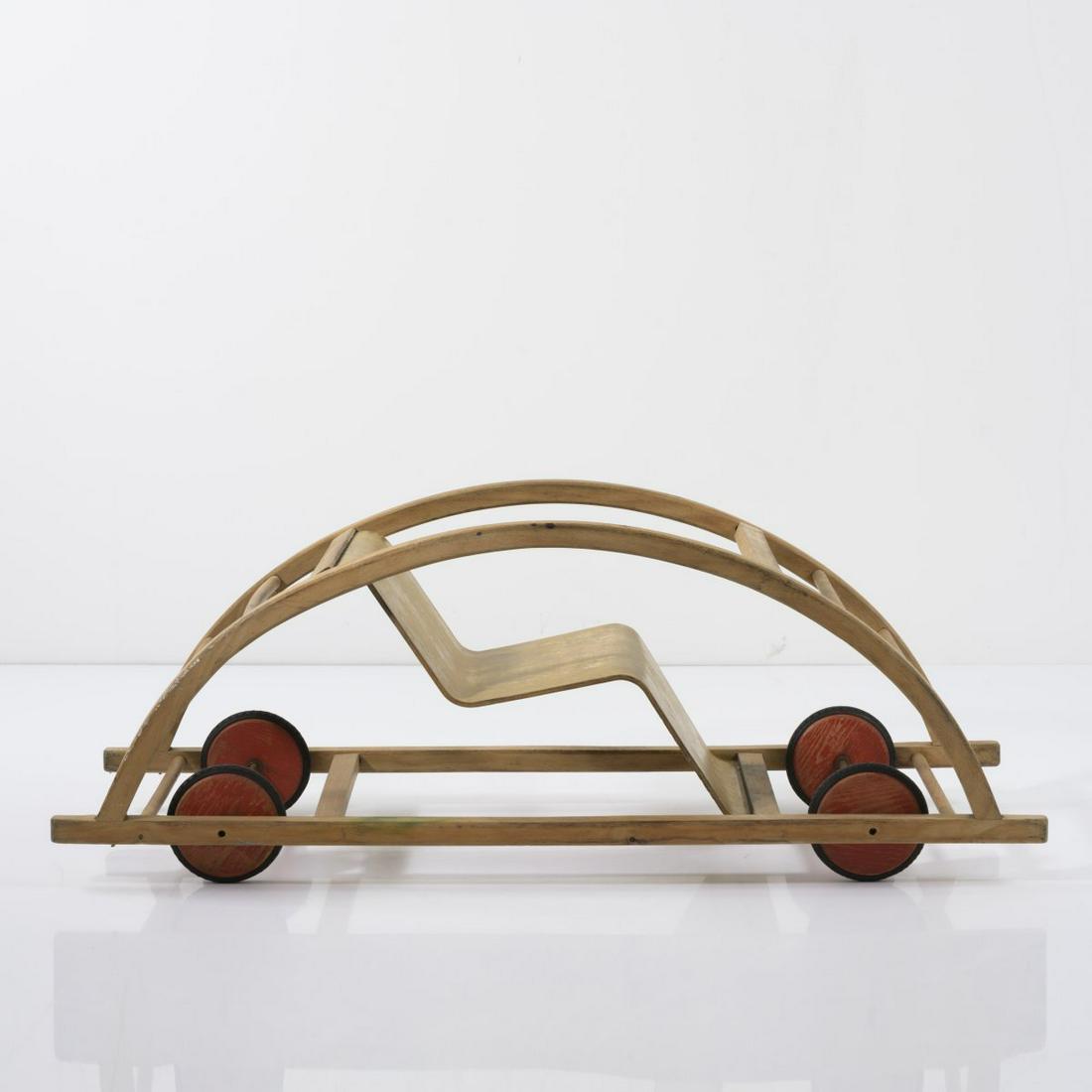 Hans Brockhage, Rocking chair / car, 1950: Hans Brockhage, Rocking chair / car, 1950, H. 36.5 x 100 x 37.5 cm. Made by Siegfried Lenz, Bergiesshubel/Pirna. Beechwood, plywood, red wheels, rubber. , Exh. cat. Fidgety Philip! A Design History of