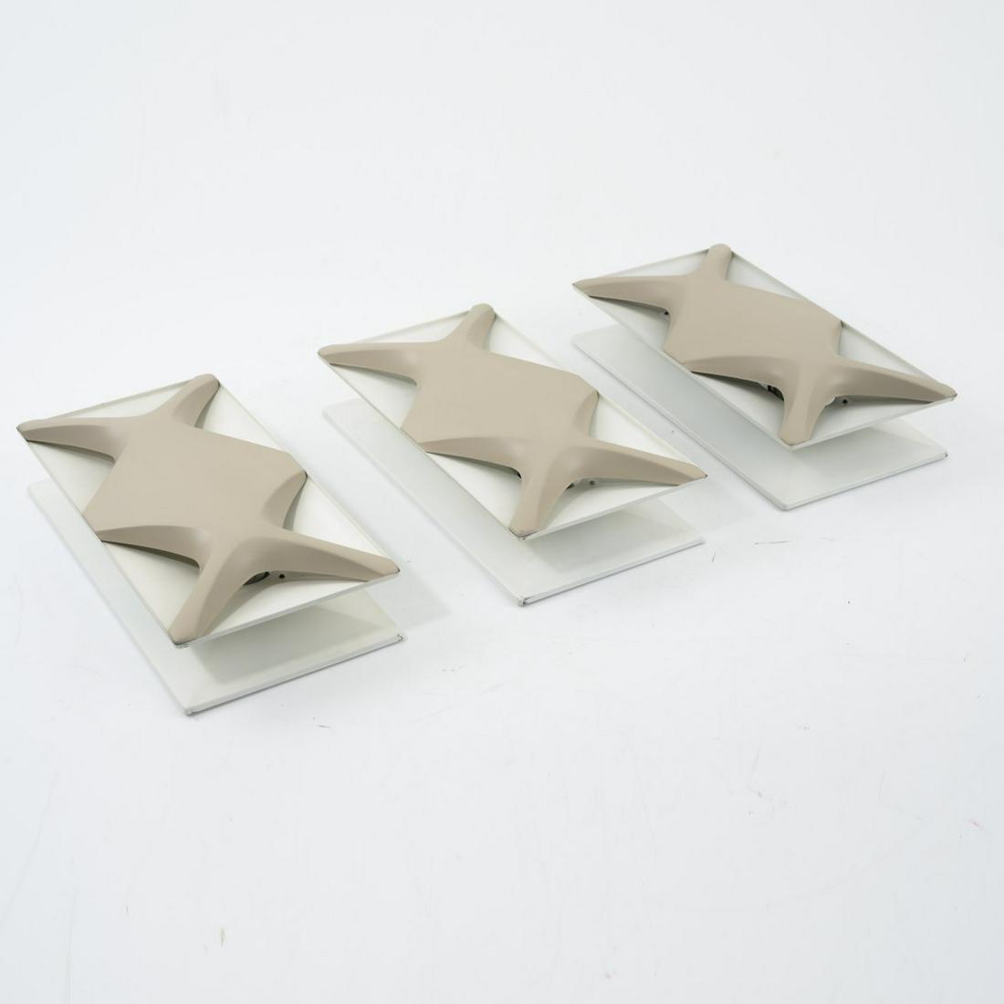 Dieter Witte; Rolf Krüger, 3 'Oyster' wall lights,: Dieter Witte; Rolf Krüger, 3 'Oyster' wall lights, 1968, H. 23 x 45 x 11 cm. Made by Staff Leuchten, Lemgo. Sheet metal, painted crème-brown and white.,