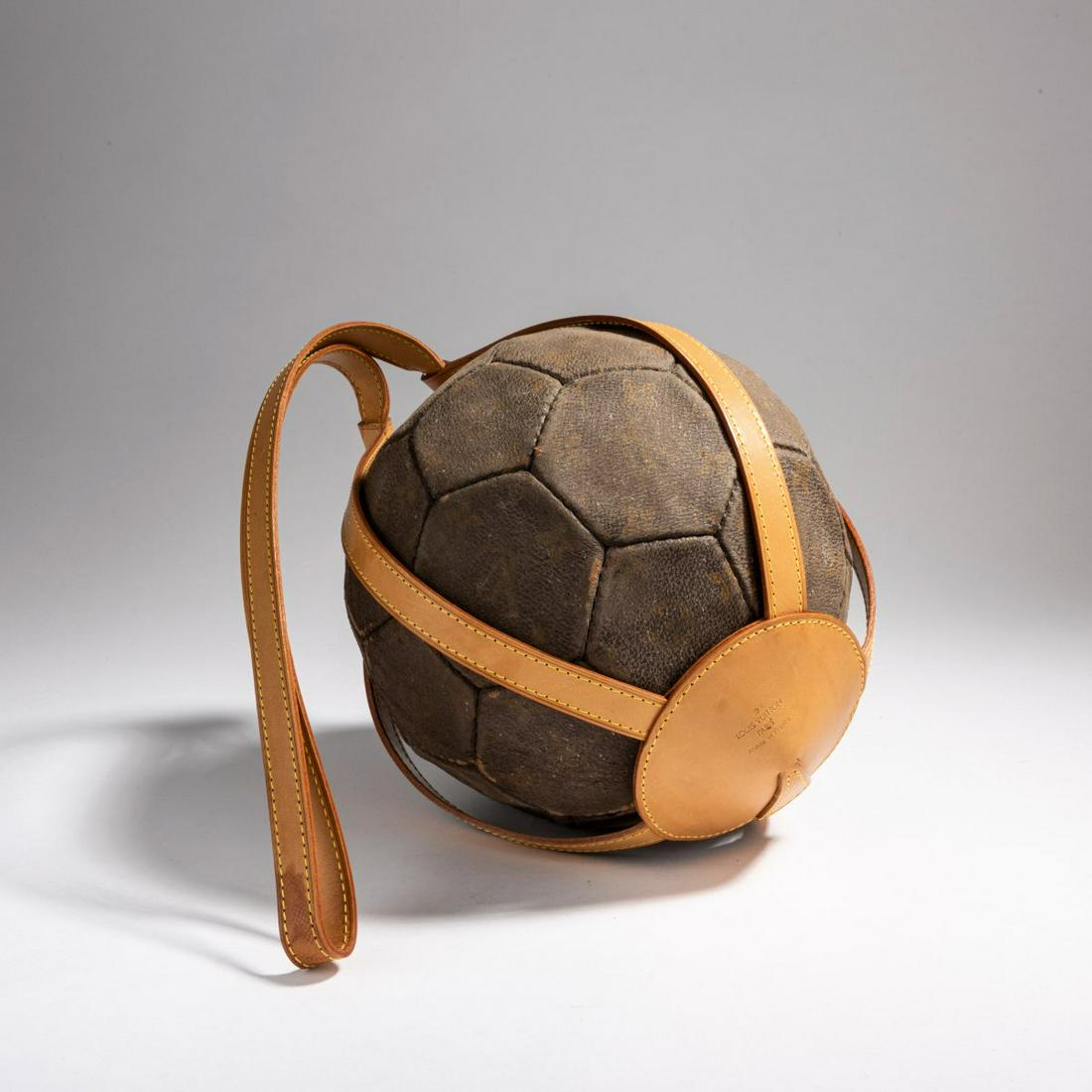 Tobias Rehberger (1966 Esslingen), 'Comme tu moi, comme: Tobias Rehberger (1966 Esslingen), 'Comme tu moi, comme je toi (entre nous)', 1999, Louis Vuitton FIFA World Cup 98 '' monogram print soccer ball by Vuitton with holder. Monogrammed on the inside of t