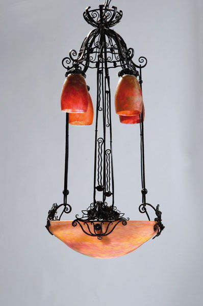 Daum Freres, Nancy: Daum Freres, Nancy. Ceiling light, c 1925. H. 85 cm; Diameter 40 cm. Cased glass, clear with powder inclusions in orange, yellow and red. Wrought iron mounting, partly bronzed. Glass signed: DAUM NANC