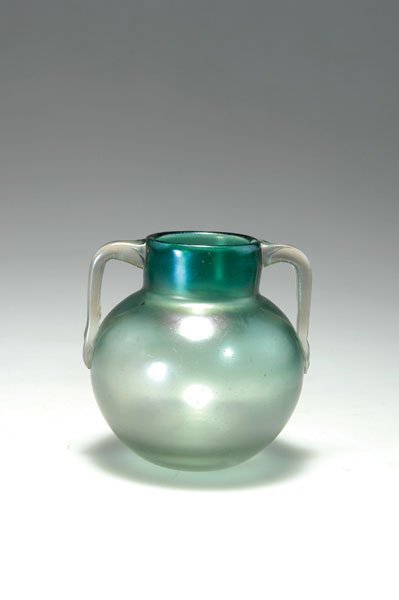 Loetz Wwe., Klostermuehle: Marie Kirschner. Vase with handles, 1901. H. 10 cm. Made by Joh. Loetz, Klostermuehle. Cased glass, clear and green, matt iridescent. Signed: MK.