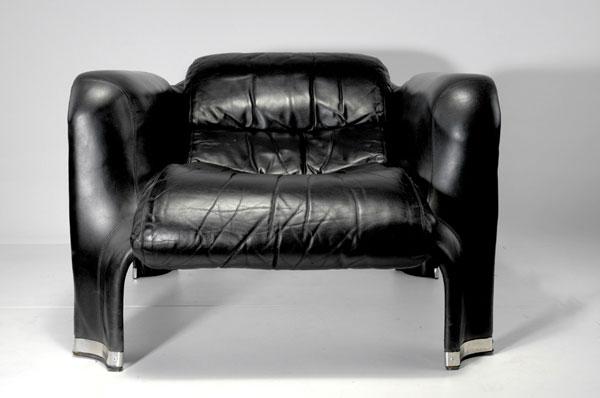 Pekka Perjo. 'Pohljola' chair, designed c. 1965. H: Pekka Perjo. 'Pohljola' chair, designed c. 1965. H. 66 x 91 x 97 cm. Made by Haimi Oy, Helsinki. Black plastic, black leather. Littérature: Images of Finnish Design, S. 78.