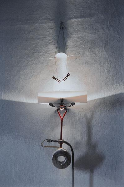 Jan Roth. Wall light, designed and made in 1984/ 8: Jan Roth. Wall light, designed and made in 1984/ 85. L. 65 cm. Toroidal transformer, Osram spotlight, white teflon, steel wire, metal clamp, plate of stainless spring steel.