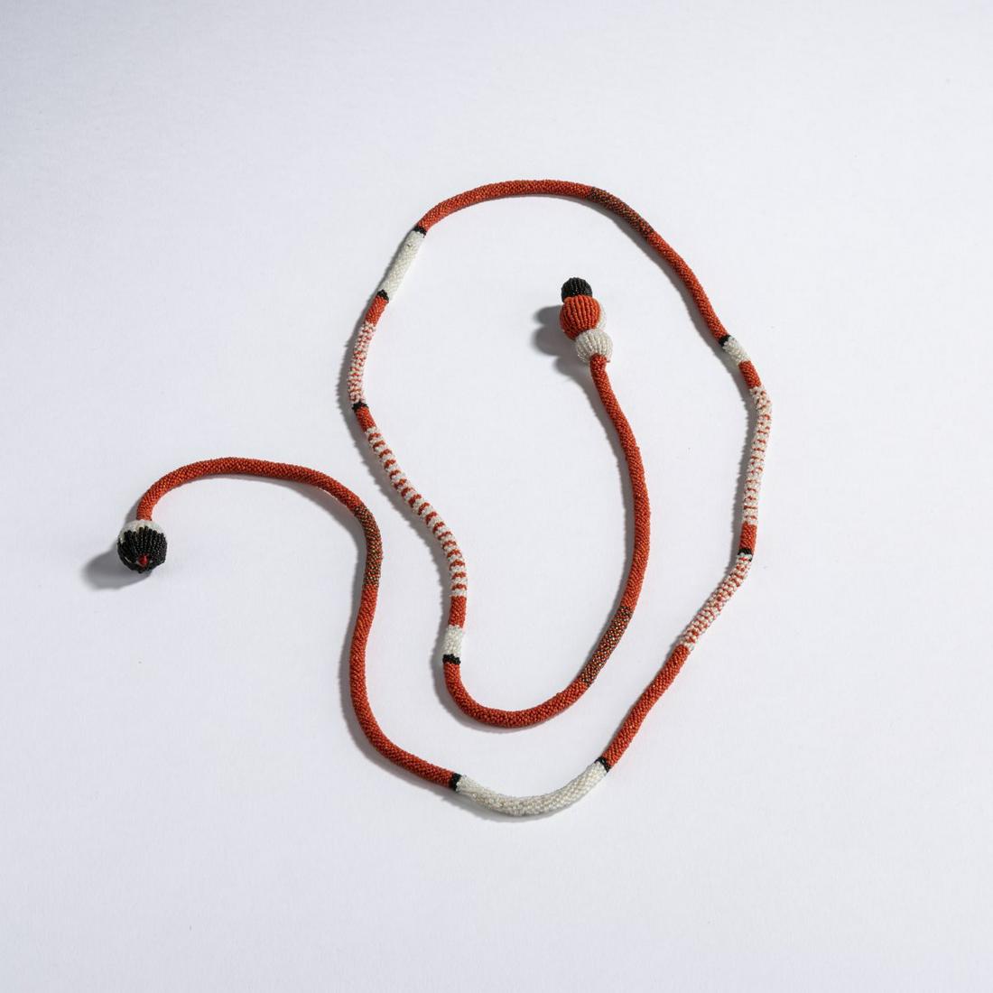 Maria Likarz, Beaded necklace, c. 1920: Maria Likarz, Beaded necklace, c. 1920, L. 113 cm. Orange, black, gray and iridescent glass beads, crocheted, bead-embroidered wooden balls.,