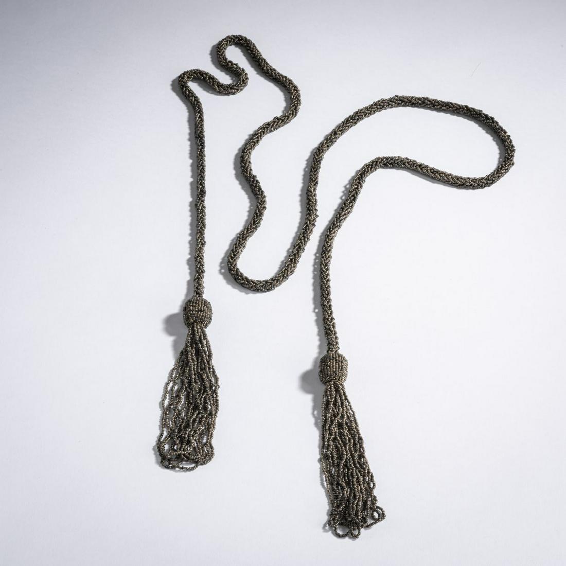 Maria Likarz, Beaded necklace, c. 1920: Maria Likarz, Beaded necklace, c. 1920, L. 170 cm. Execution: Wiener Werkstätte. Silver-gray glass beads, threaded and braided, bead-embroidered wooden balls.,