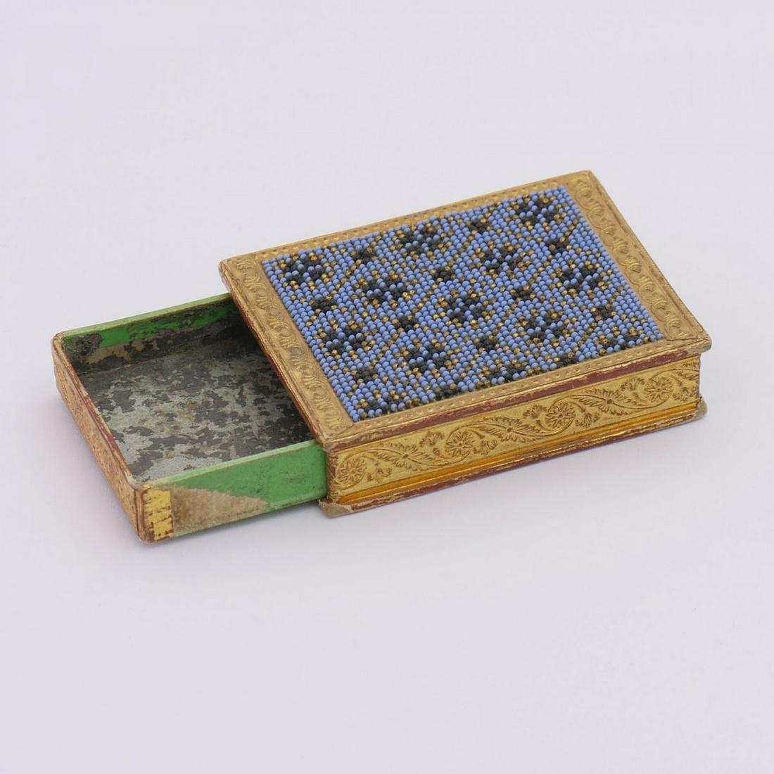 Matchbox, 19th century: Matchbox, 19th century, H. 2 x 5,9 x 7,7 cm. Polychrome bead embroidery, cardboard. ,