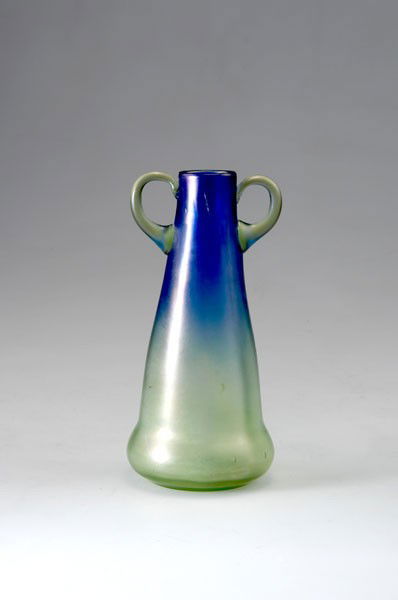 Loetz, Klostermuehle. Luna vase, 1901-02. H. 17.7: Loetz, Klostermuehle. Luna vase, 1901-02. H. 17.7 cm. Made for E. Bakalowits Sons, Vienna. Production no. 85/4016-II. Cased glass, slightly green, blue, optically blown. Pattern: Luna optisch, slightl