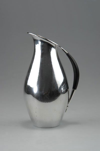 Johan Rohde (1856 - 1935), Copenhagen: Johan Rohde. '432' ewer, 1920. H. 22.6 cm. Made by Georg Jensen, Copenhagen, past 1945. Silver, handle of exotic wood. Marked: DESSIN JR, DENMARK, GEORG JENSEN (oval), STERLING, 432, E.