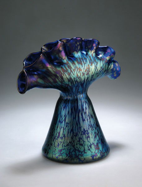 Johann Loetz Wwe., KlostermŸhle. Vase in the shap: Johann Loetz Wwe., KlostermŸhle. Vase in the shape of a fan. H. 19.7 cm. Blue glass, Papillon pattern, strong matt mother-of-pearl lustre.