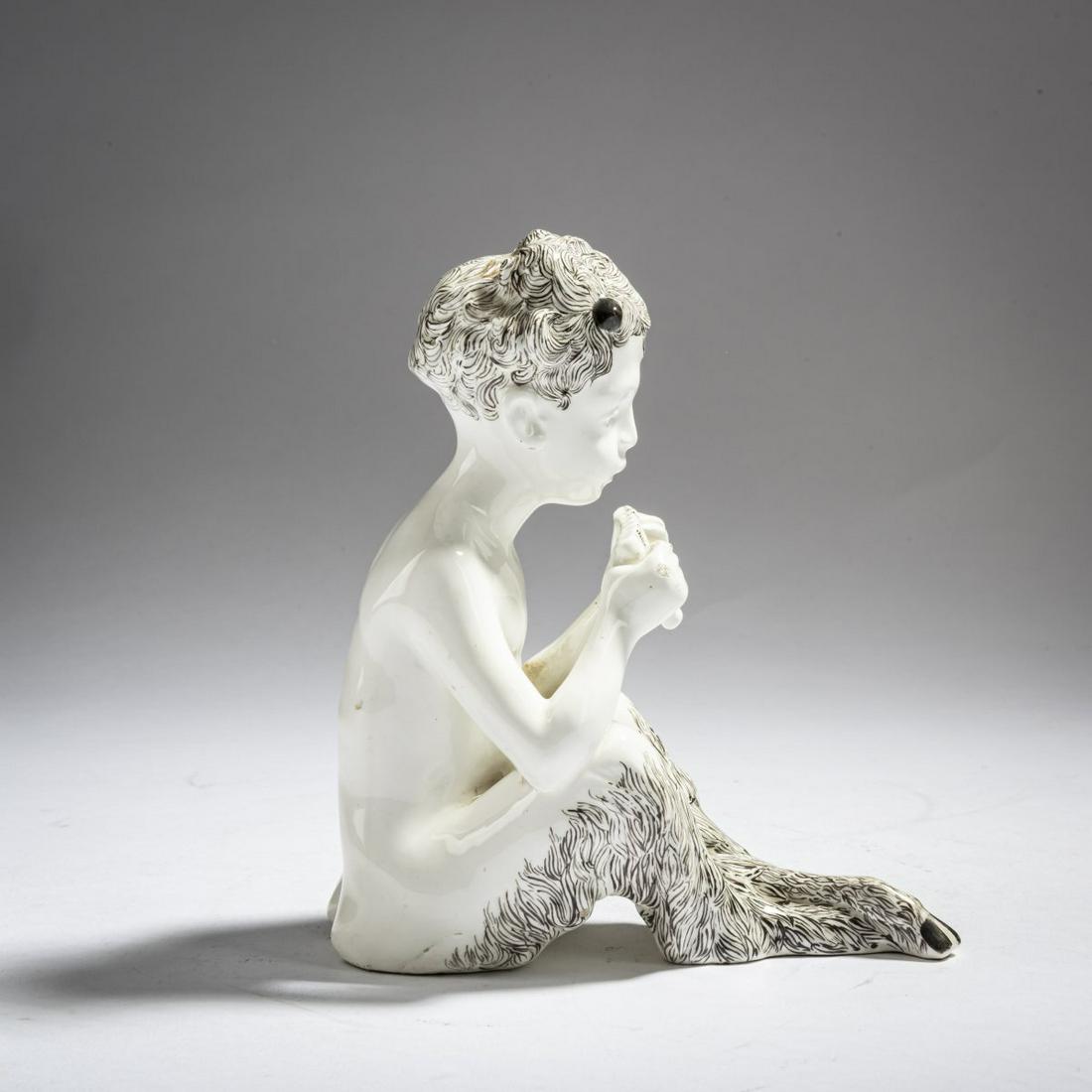 Hans Stoltenberg-Lerche, 'Seated Pan playing the flute', c. 1900: Hans Stoltenberg-Lerche, 'Seated Pan playing the flute', c. 1900, H. 15.8 cm. Execution: Friedrich Goldscheider, Vienna. Earthenware, glazed black on white. Signed on the back: Lerche (embossed), 4770