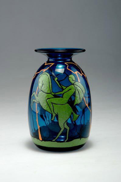 Marcel Goupy. Vase, circa 1928. H. 21.5 cm. Blue glass,: Marcel Goupy. Vase, circa 1928. H. 21.5 cm. Blue glass, enamel in orange, green and black, motive with rider, hunting deer in front of stylised trees. Signed: M. Goupy.