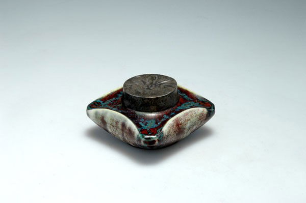 Pierre Adrien Dalpayrat, Bourg-la-Reine. Inkwell, circa: Pierre Adrien Dalpayrat, Bourg-la-Reine. Inkwell, circa 1905. H. 4.8 cm. Stoneware, oxblood glaze on white, clear glass inset, cover of pewter with chrysanthemum. Marked: 71, Dalpayrat.