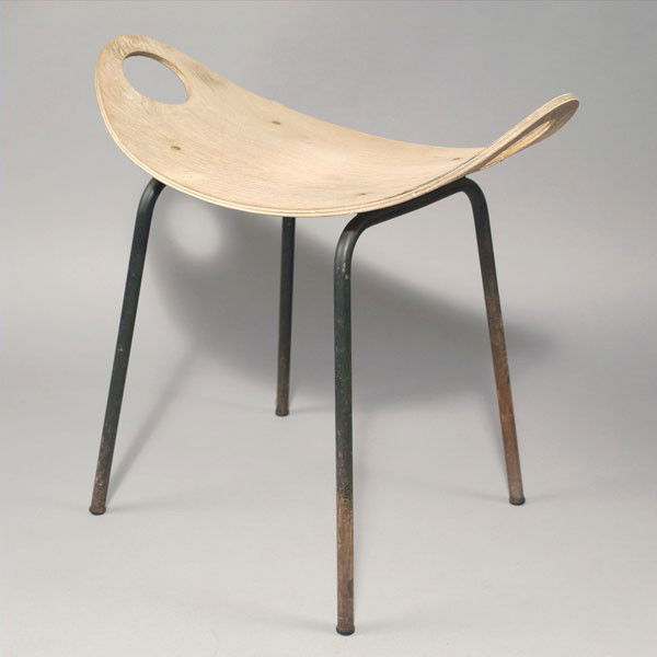 Olavi Kettunen. Stool, designed in the 1950s. H. 51.5 x: Olavi Kettunen. Stool, designed in the 1950s. H. 51.5 x 56.5 x 30 cm. Made by J. Merivaara Oy, Helsinki. Plywood, tubular steel, painted black. Marked: Maker's label.