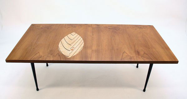 Tapio Wirkkala. Coffee table, designed in 1954. H. 36 x: Tapio Wirkkala. Coffee table, designed in 1954. H. 36 x 124 x 62 cm. Produced by Asko Oy, Helsinki. Tubular steel, painted black, mahogany veneer, plywood leaf. Marked: made in finland asko Tapio Wirk