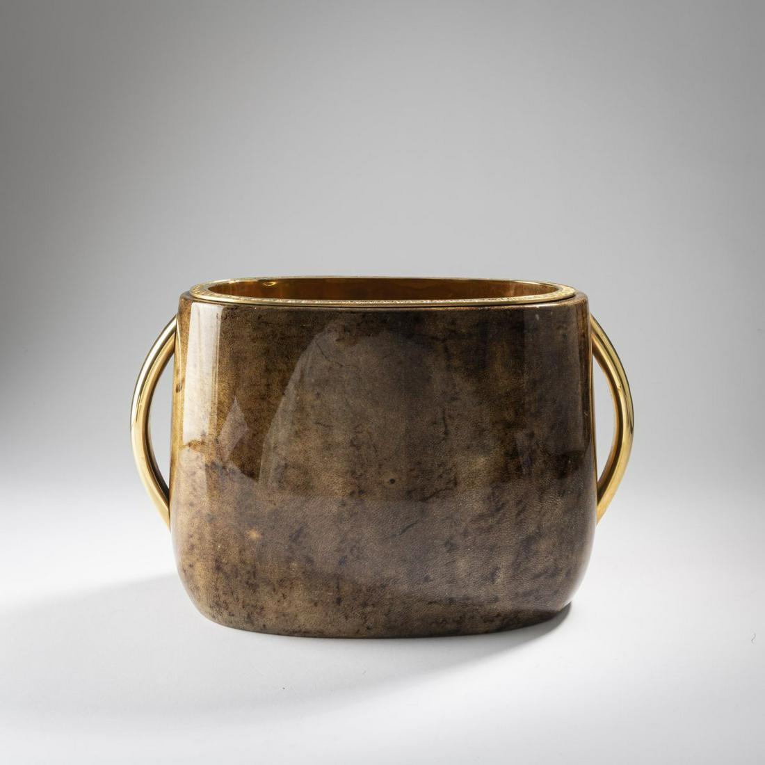 Aldo Tura, Wine cooler, 1950s: Aldo Tura, Wine cooler, 1950s, H. 23 x 37 x 15.5 cm. Made by Tura, Milan. Wood, covered in goatskin dyed brown, clear lacquer, punched brass insert.,