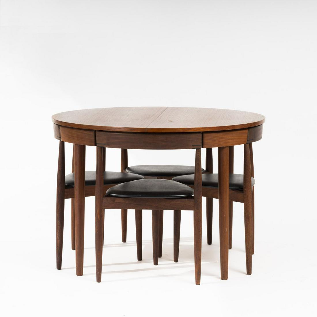 Hans Olsen, Table and 4 chairs, 1962: Hans Olsen, Table and 4 chairs, 1962, Table: H. 74 cm,Ø 106 cm (extended: 106 x 156 cm), chair: H. 72.5 x 50 x 46 cm. Made by Frem Rojle Furniture Factory, Denmark. Teak, stained dark, blockboa