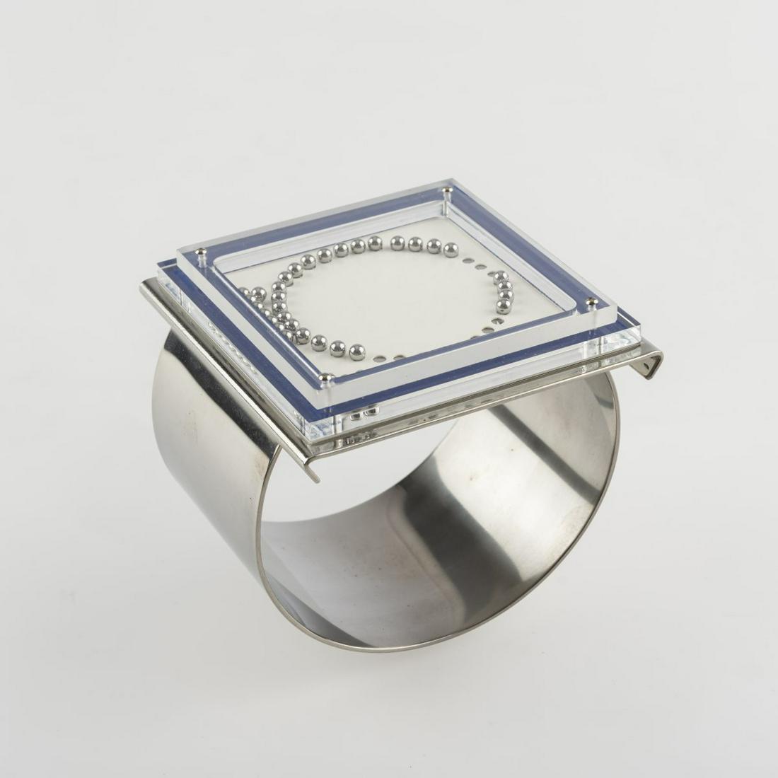 Gerd Rothmann (1941 Frankfurt/Main - lives in Munich), Bangle, 1970, Stainless steel, chrome-plated: Gerd Rothmann (1941 Frankfurt/Main - lives in Munich), Bangle, 1970, Stainless steel, chrome-plated brass, plexiglass, white and blue paper, steel balls. 87.10 grams. Ø (inside) 50-61 mm. Editi