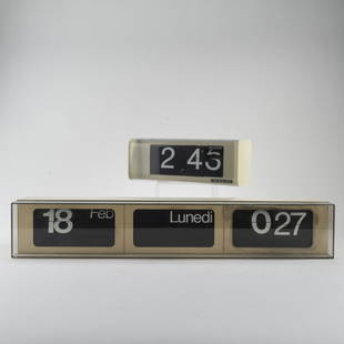 Gino Valle, 2 'CIFRA' wall clocks, c. 1965: Gino Valle, 2 'CIFRA' wall clocks, c. 1965, H. 10 x 27 x 11 cm; H. 11.5 x 66.5 x 13 cm. Made by Solari & C., Udine. Plastic, white, black and colorless. Marked: Manufacturer's label.,