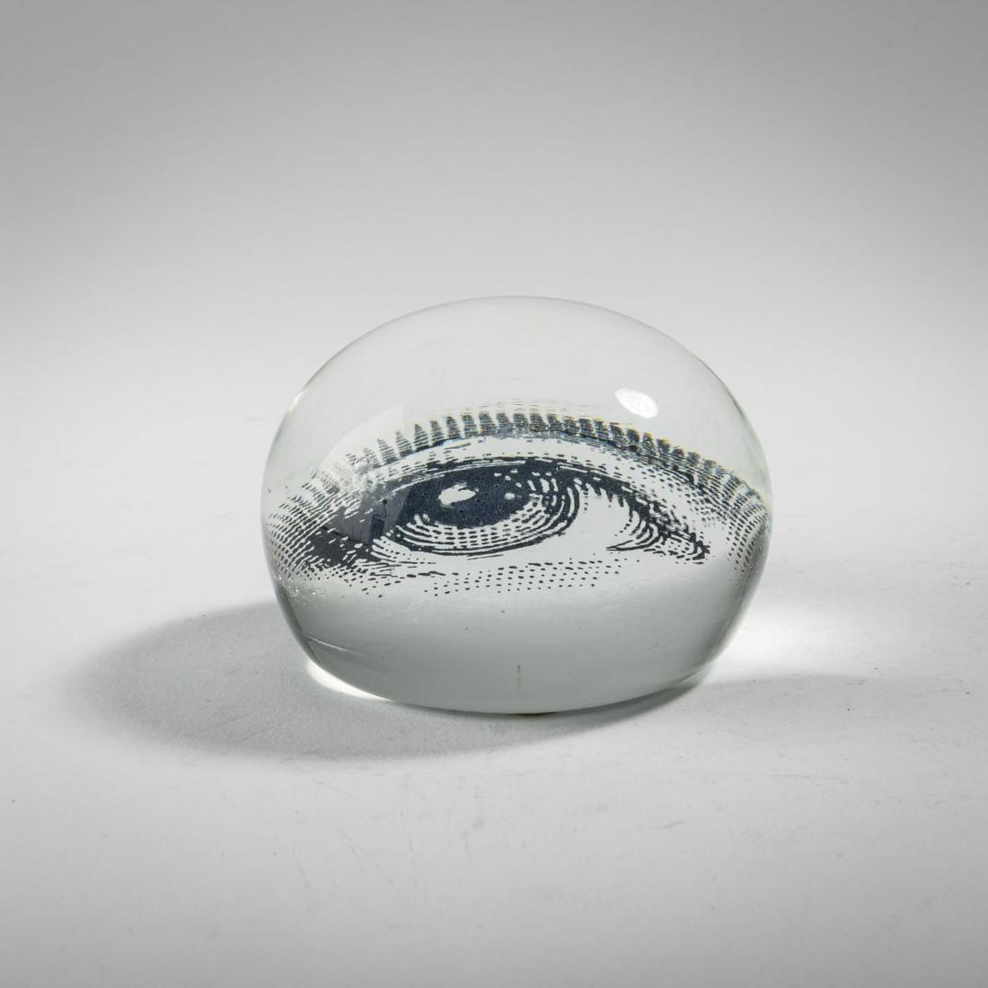 Barnaba Fornasetti, 'Occhio' paperweight, 1990s: Barnaba Fornasetti, 'Occhio' paperweight, 1990s, Ø 8 cm. Made by Fornasetti, Milan. Cased glass, screen printing. Marked: FORNASETTI (engraved).,