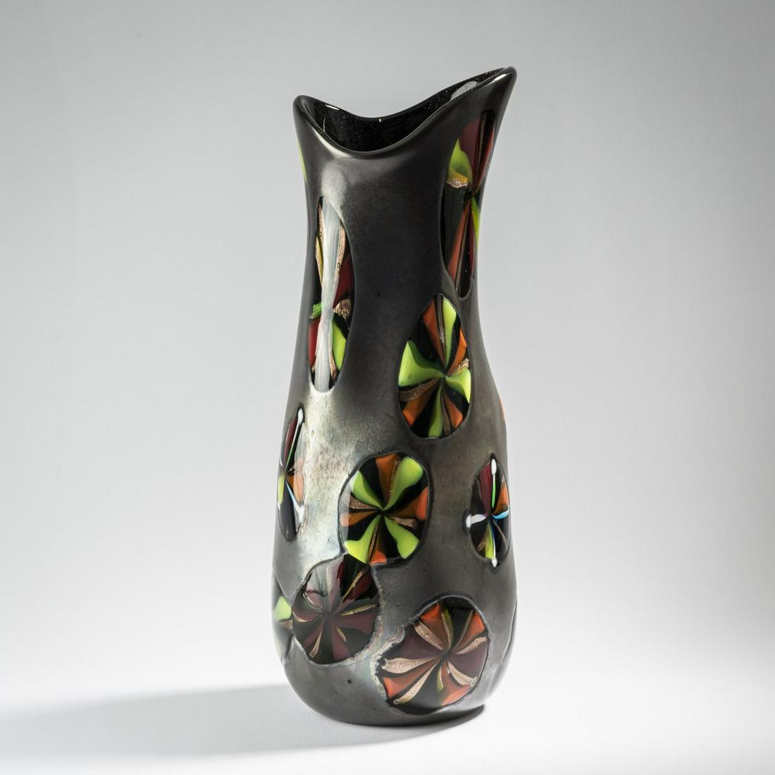 Pollio Perelda, 'Nerox stellato' vase, 1954: Pollio Perelda, 'Nerox stellato' vase, 1954, Amorphous shape. H. 42 cm. Execution: Fratelli Toso. Colorless glass, deep gray iridescent powder fusions, fused murrine in combinations of yellow, green a