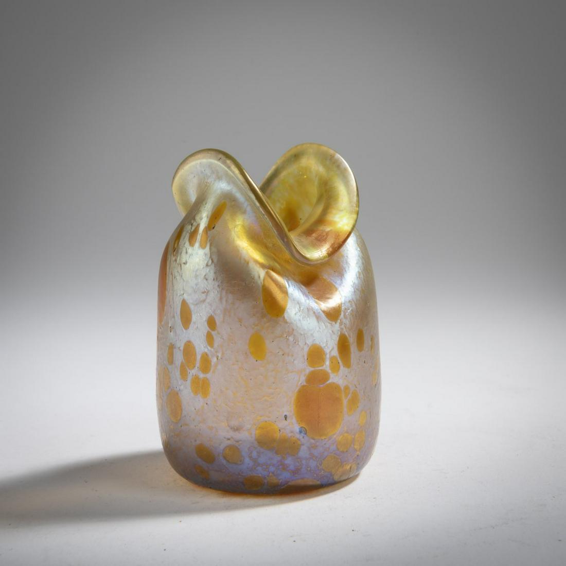 Loetz, Klášterský Mlýn, Small 'Asträa' vase, 1900: Loetz, Klášterský Mlýn, Small 'Asträa' vase, 1900, H. 8.9 cm. Colorless glass, Asträa decoration of amber dots, background with dense silver-yellow fusions, Candi