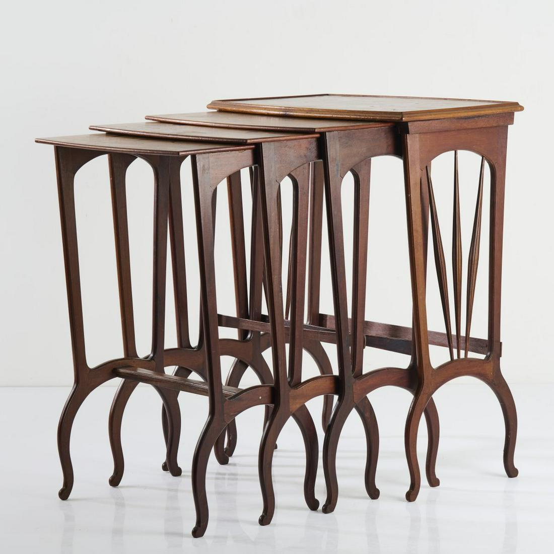 Louis Majorelle, 4 nesting tables, c. 1910: Louis Majorelle, 4 nesting tables, c. 1910, H. 72.5-78 cm, 43.5-68 x 39.5 cm. Mahogany, carved, walnut wood, inlaid images made of different precious woods, motifs with roses, mistletoe, honeysuckle a