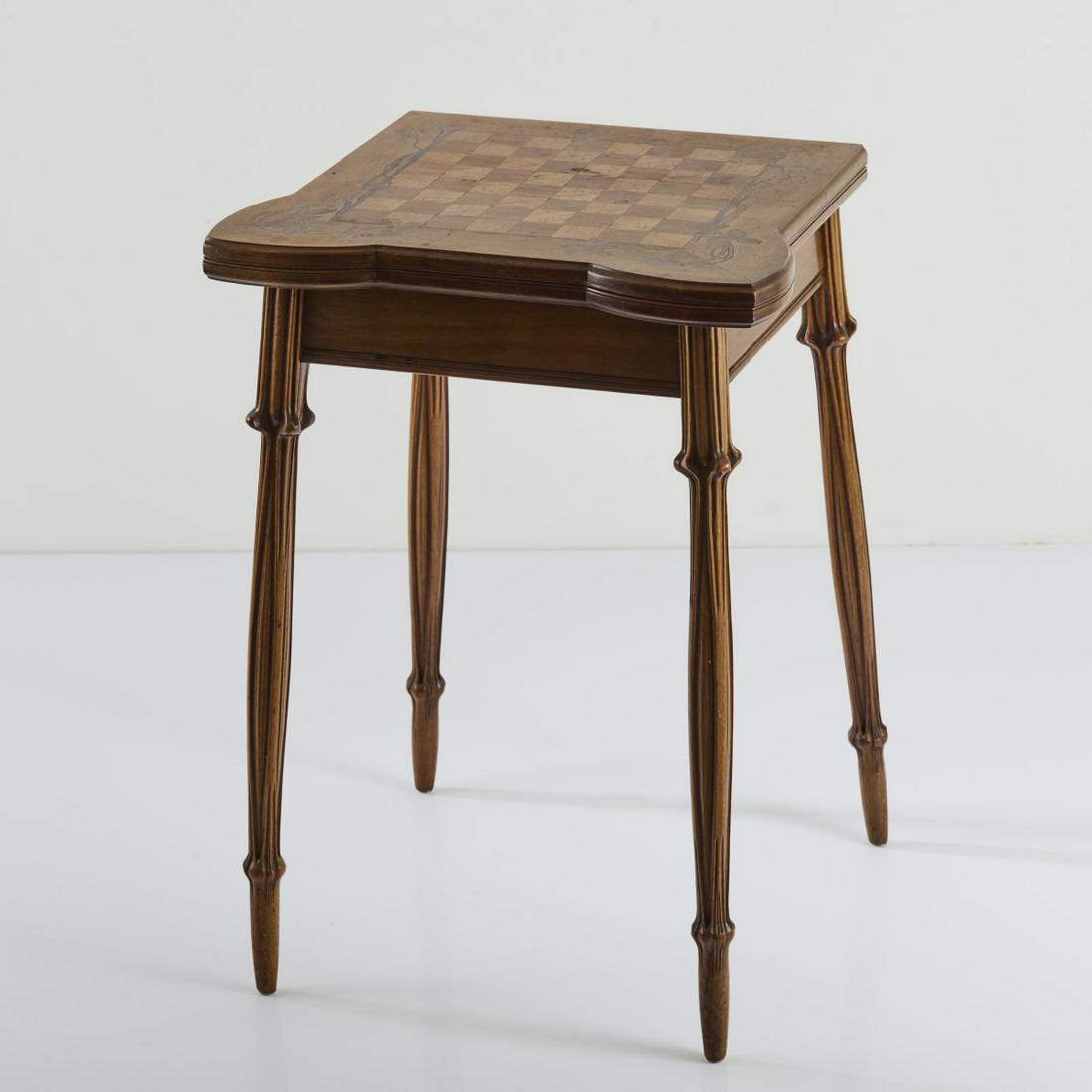 Louis Majorelle, Game table, c. 1905: Louis Majorelle, Game table, c. 1905, H. 78 cm, 55.5 x 50.5-101 cm. Walnut, carved. Intarsia pictures made of different precious woods, motif with clover. Signed: L Majorelle (inlaid)., Cf. Duncan, Th