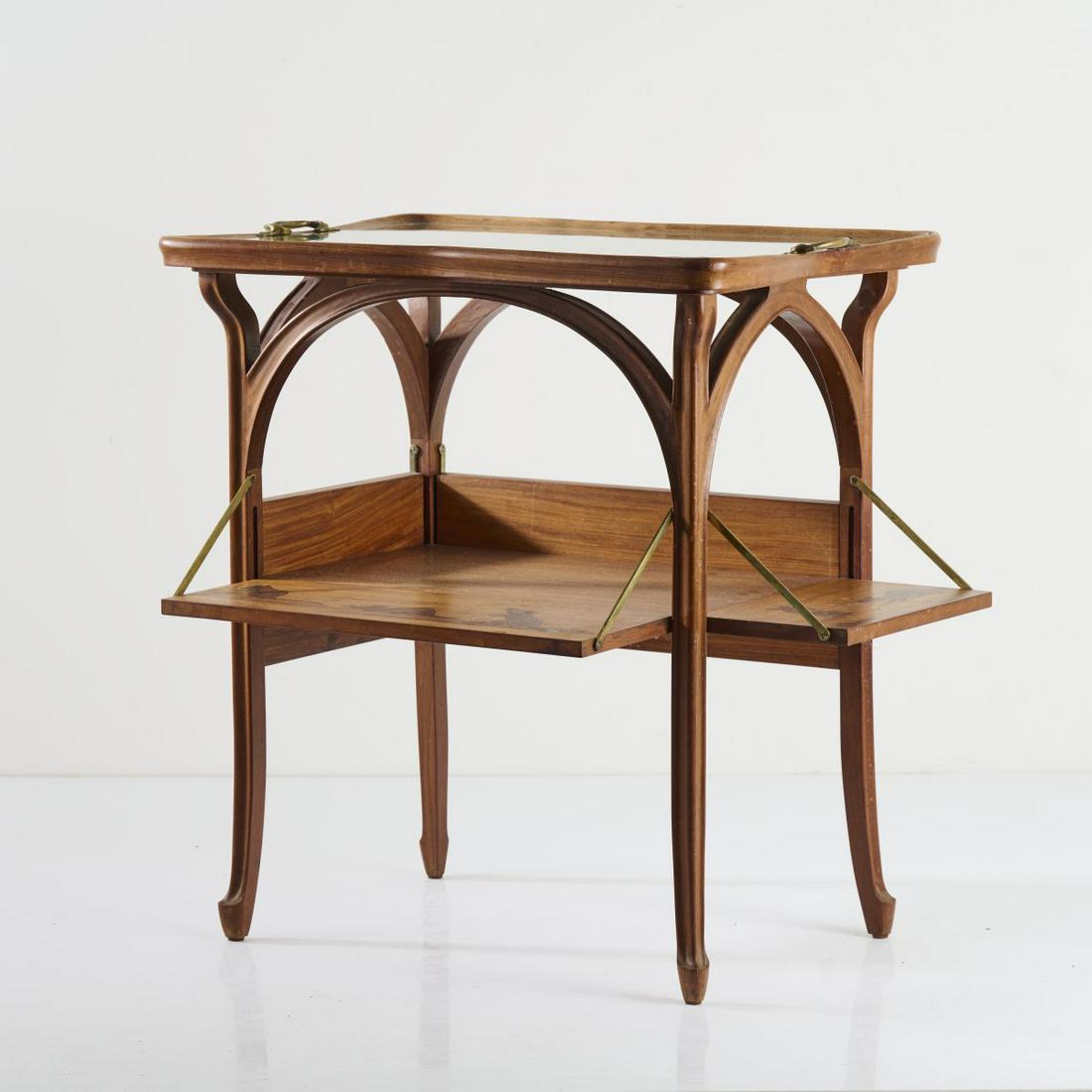 Louis Majorelle, Fold-out tea table, c. 1910: Louis Majorelle, Fold-out tea table, c. 1910, H. 76.5 cm, 71-90 x 48.5-68 cm. Walnut, carved. Inlaid images made of different precious woods, motif with hazelnut branches, motif with mice and hazelnut