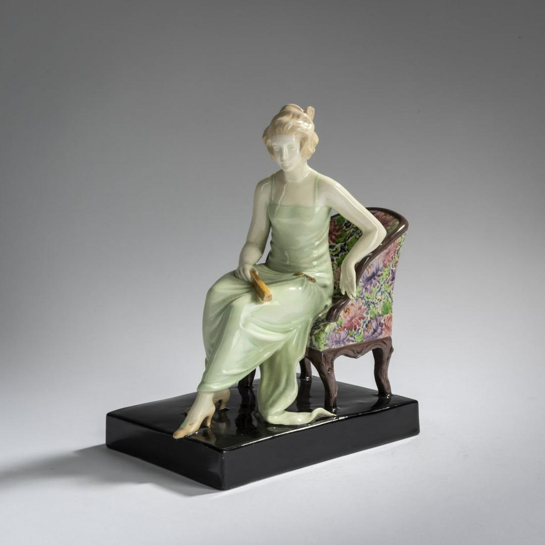 Wiener Kunstkeramische Werkstätte, Busch & Ludescher, Girl sitting with a fan, c. 1920: Wiener Kunstkeramische Werkstätte, Busch & Ludescher, Girl sitting with a fan, c. 1920, H. 23 cm. Earthenware, polychrome glaze. Marked: Manufacturer's mark AUSTRIA 1825, 8, 8 (embossed).,