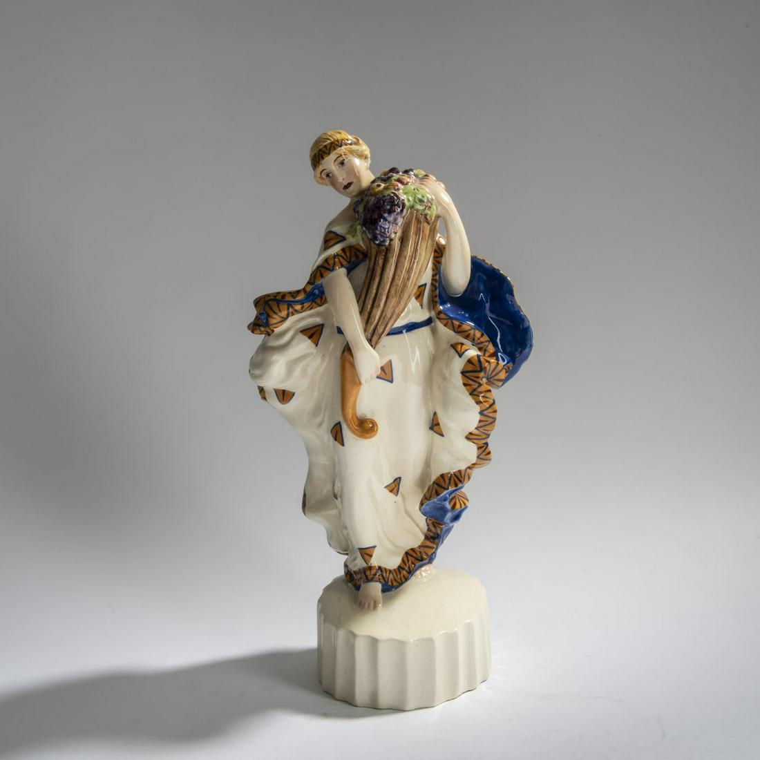 Wiener Kunstkeramische Werkstätte, Busch & Ludescher, Woman with a cornucopia, 1920s: Wiener Kunstkeramische Werkstätte, Busch & Ludescher, Woman with a cornucopia, 1920s, H. 35 cm. Earthenware, polychrome glaze. Marked: Manufacturer's mark, AUSTRIA, 1695 (embossed).,