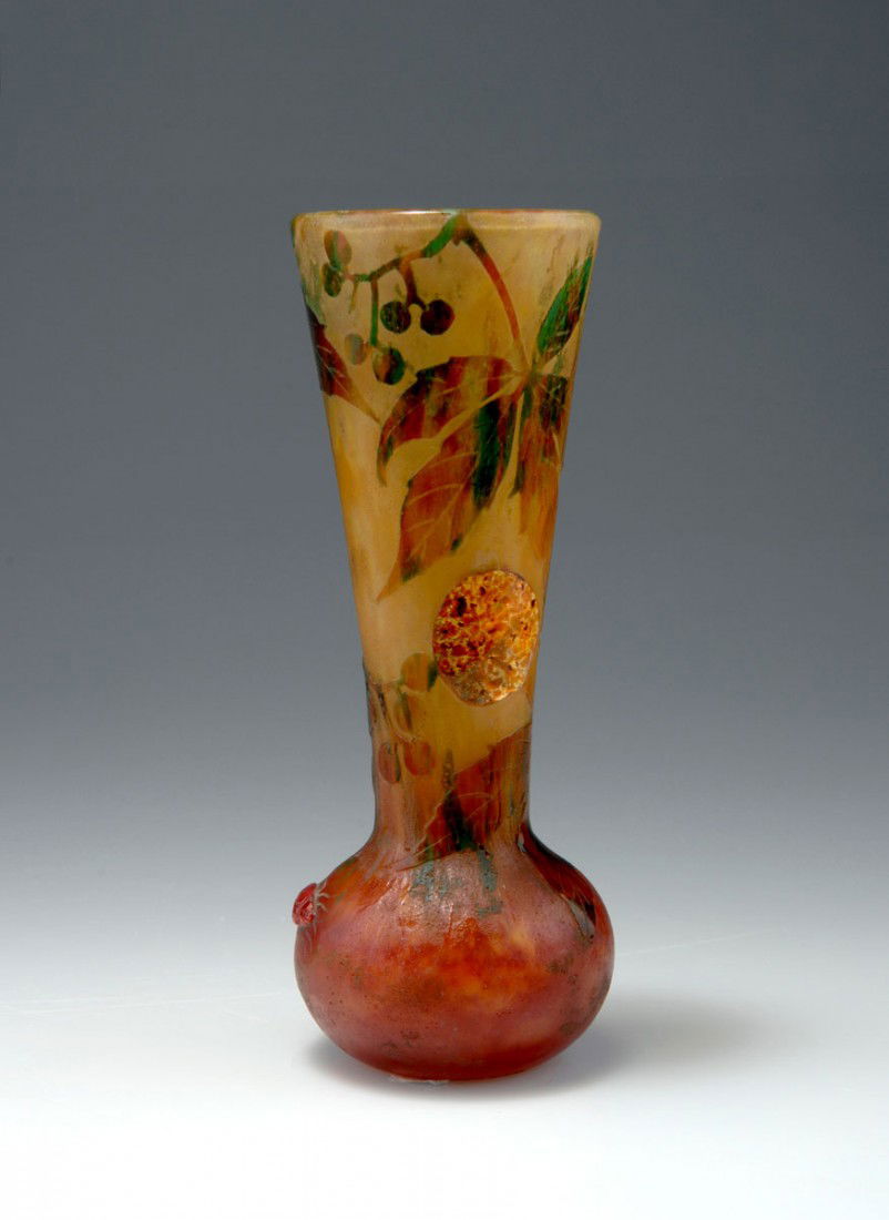 Vase 'Vigne Vierge', 1903: Daum Freres, Nancy. 'Vigne Vierge' vase, 1903. H. 16.1 cm. Cased glass, clear, yellow and pink powder inclusions, greenish, brownish and claret-red enamel fusions. Multiply etched pattern with vine. T