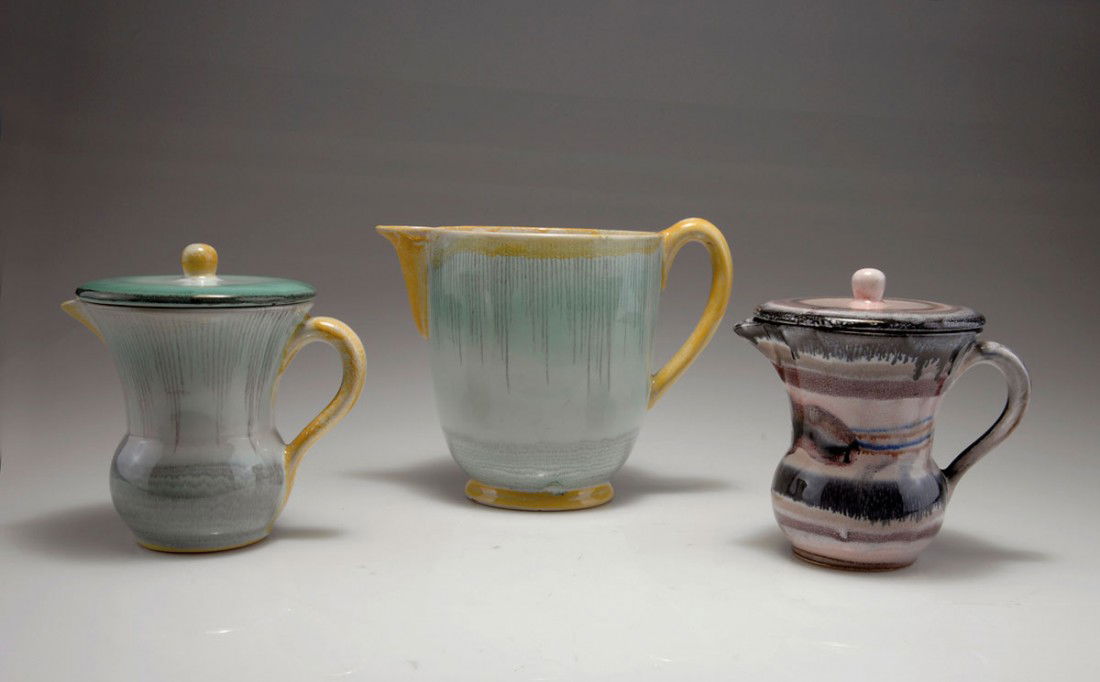Drei Saftkruege: Werner Burri. Three juice ewers, designed circa 1928. H. 12.7 cm; H. 13.5 cm; H. 15.3 cm. Made by Velten-Vordamm. Majolica, glazed green-yellow and grey, resp. pink and purple on white. Marked: Maker'