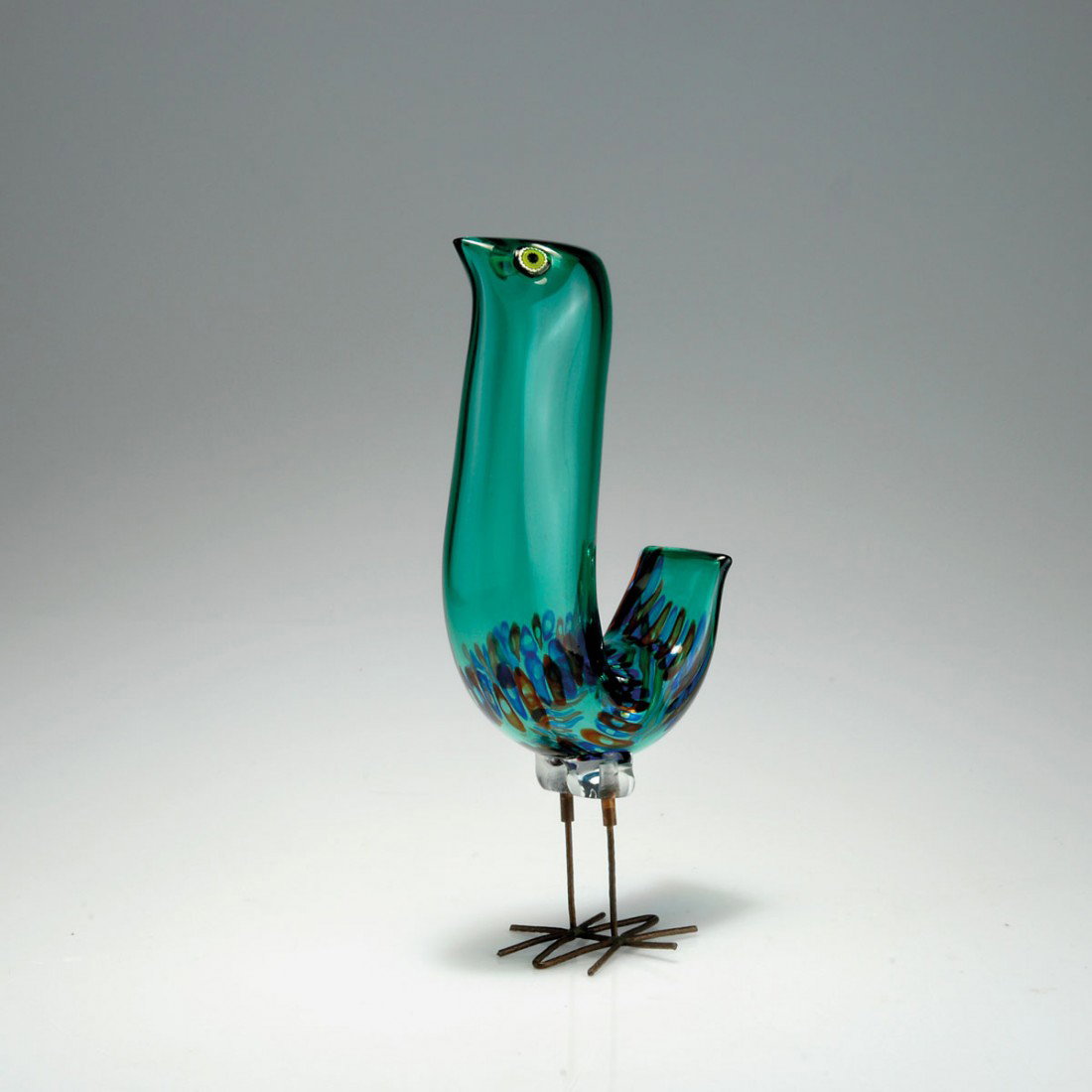 Vogel 'pulcino': Alessandro Pianon. 'Pulcino' bird. H. 30 cm. Designed in 1962. Made by Vetreria Vistosi. Clear cased glass with petrol green layer and murrhines bands in red and blue, fused murrhines as eyes, legs of