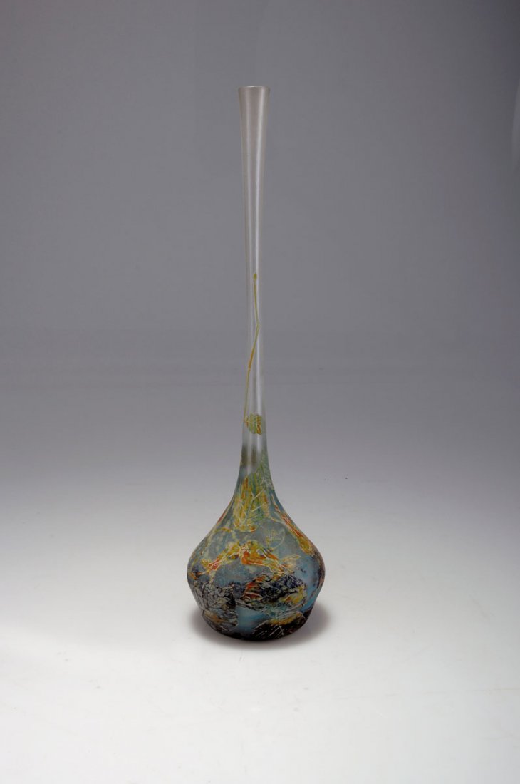 Berluze 'Noisettes', um 1910: Daum Frères, Nancy. 'Noisettes' vase, c1910. H. 38.4 cm. Cased glass, clear, powder inclusions in blue and green, lightgreen, deep blue and redbrown enamel fusions. Etched pattern with hazle on matt