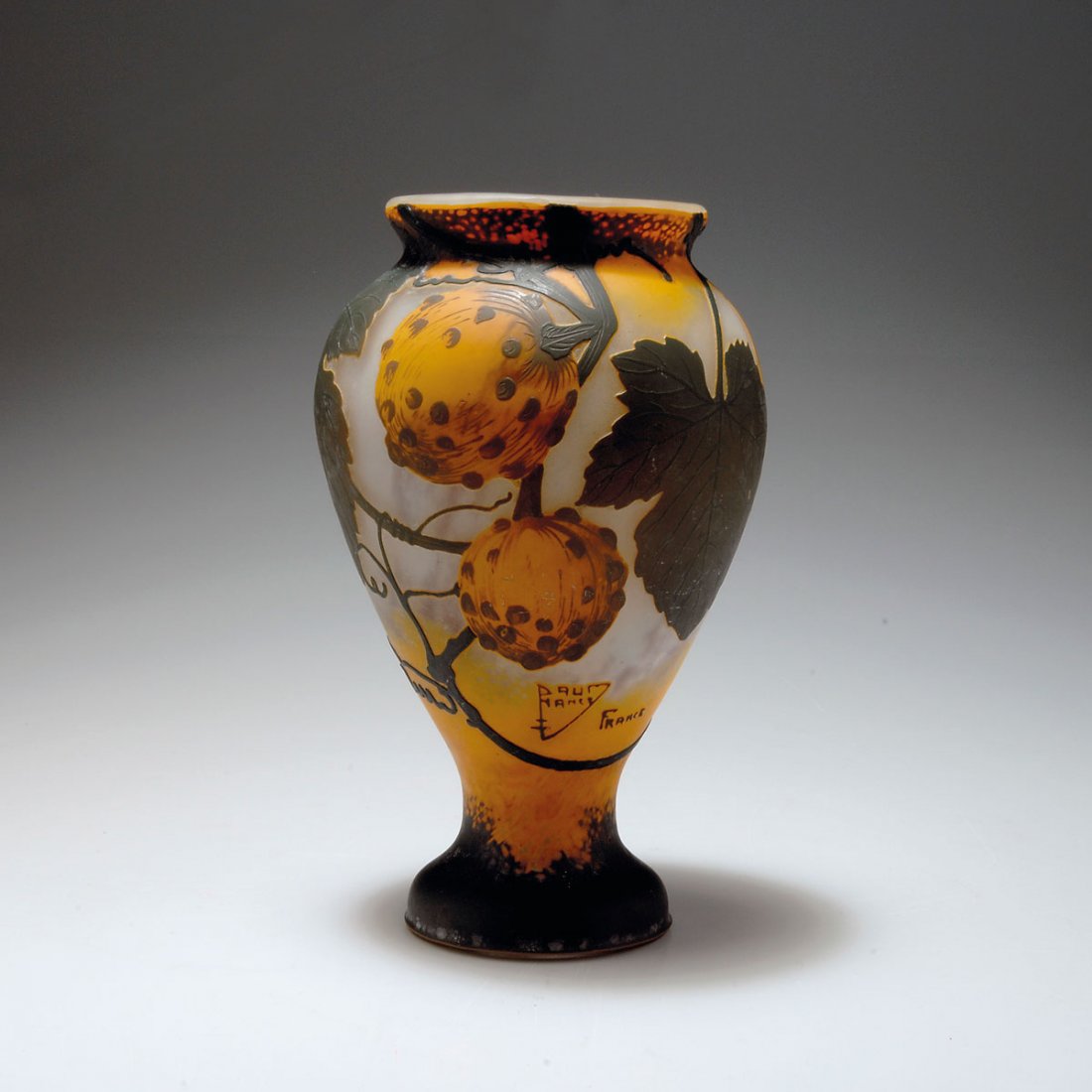 Vase 'Coloquinte des Jardins', 1923: Daum Frères, Nancy. 'Coloquinte des Jardins' vase, 1923. H. 20.6 cm. Cased glass, clear, orange and darkbrown. Multiply etched pattern with pumpkin. Signed: DAUM NANCY, cross of Lorraine, FRANCE.