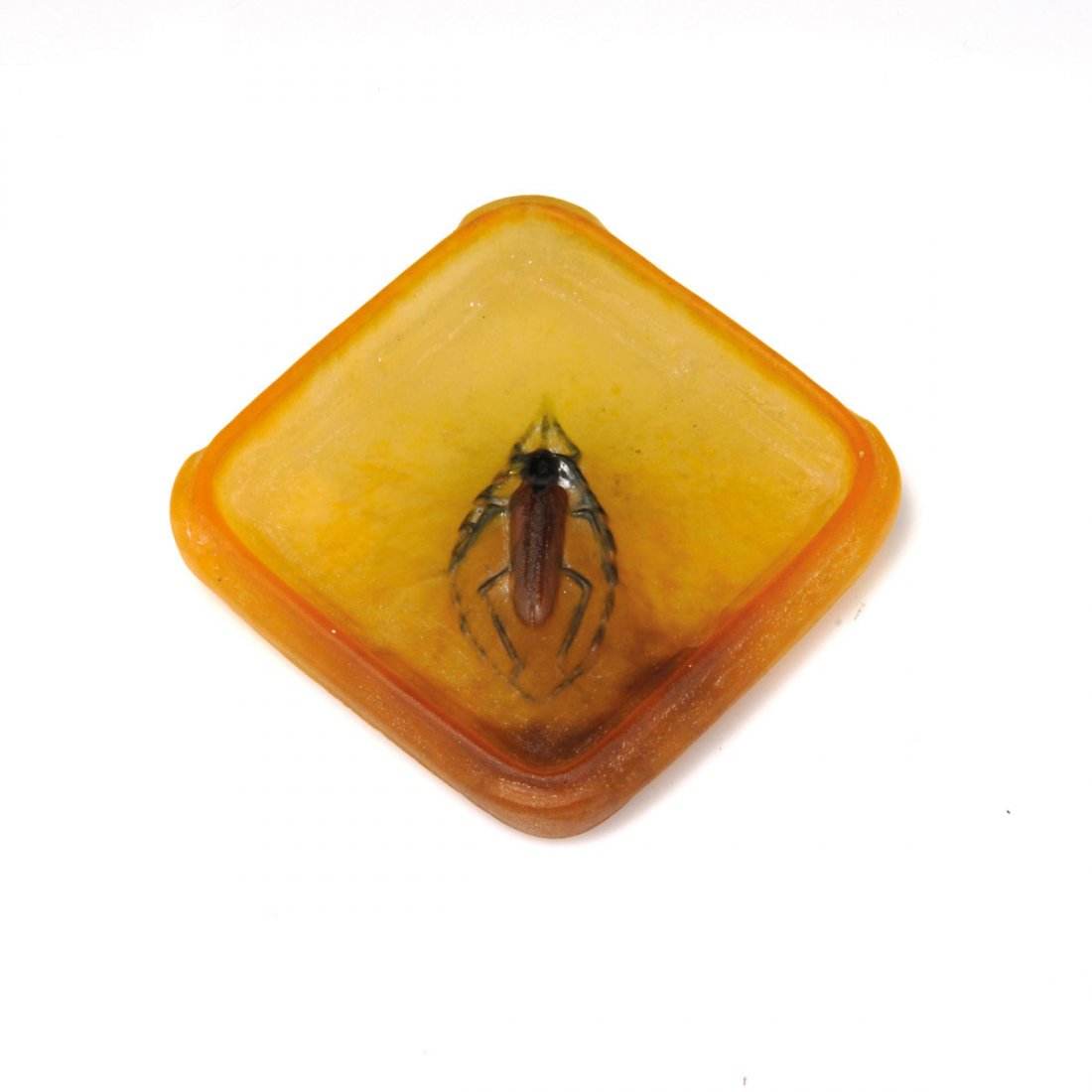 Vide poches 'Capricorne du chêne', um 1925 : Amalric Walter, Nancy. Vide poches 'Capricorne du chêne', c1925. 8.2 x 8.4 cm. Pâte de verre, opaque gather, moulded, mostly yellow and amber, capricorn beetle, brown and black powder fusions. Not s