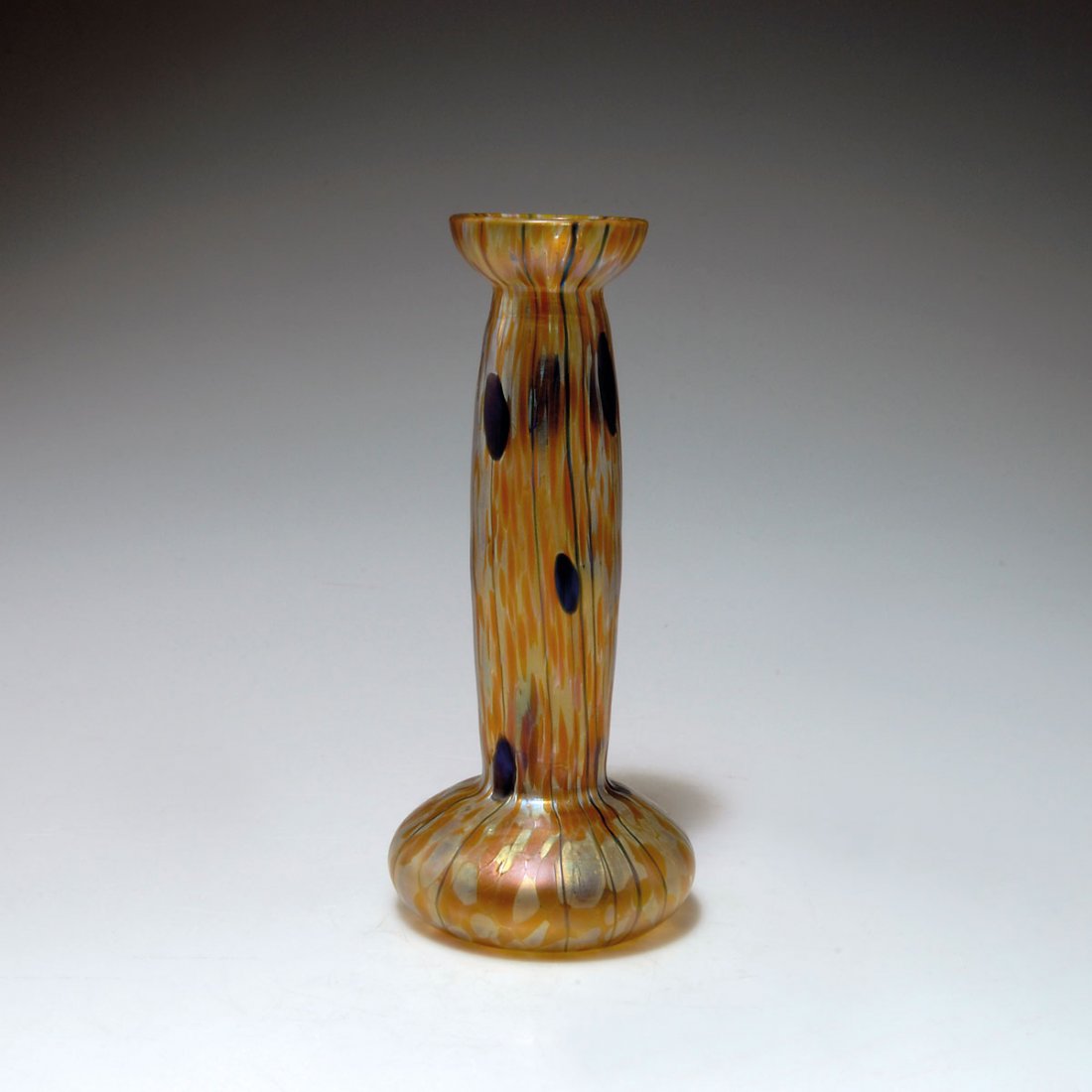 Vase, 1900-04: Loetz, Klostermühle. Vase, 1900-04. H. 20.8 cm. Clear glass, fused crushed glass in silver-yellow and orange, applied threads and dots, iridised.