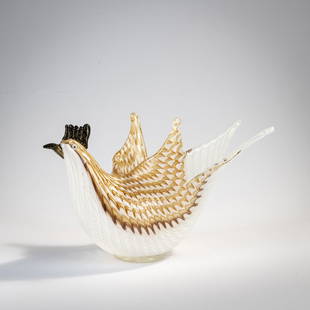 Dino Martens, Bird-shaped 'Filigrana semplice a trina' bowl, 1952: Model no. 5108. H. 14 cm. Execution: Aureliano Toso. Cased glass, colorless with combed threads in white, amber and aventurine. Beak, crest and eyes deep violet with burst gold foil. Literature: Cf.