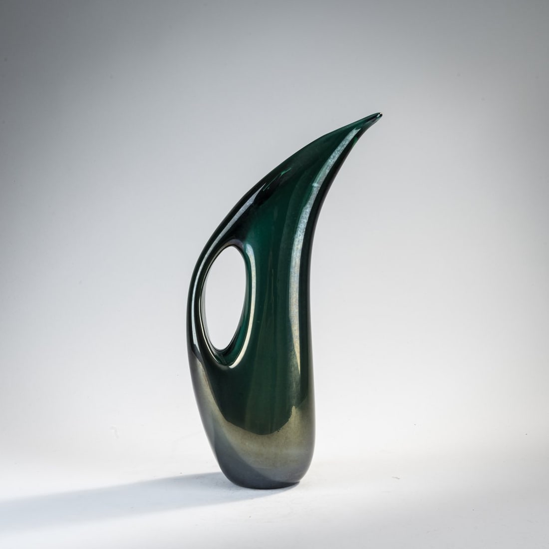 Giorgio Ferro, 'Anse volante' vase, c. 1952: H. 34 cm. Execution: A.Ve.M. Cased glass, colorless and green, iridescent.