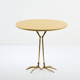 Meret Oppenheim, Side table 'Traccia', 1971: H. 64 x 67.5 x 52.5 cm. Made by Simon Gavina, Milan. Cast bronze, wood, gilded.  Literature: Vercelloni, Das Abenteuer des Design: Gavina, Milan 1987, no. 125; Cat. Ultramobile simongavina, Milan nd,