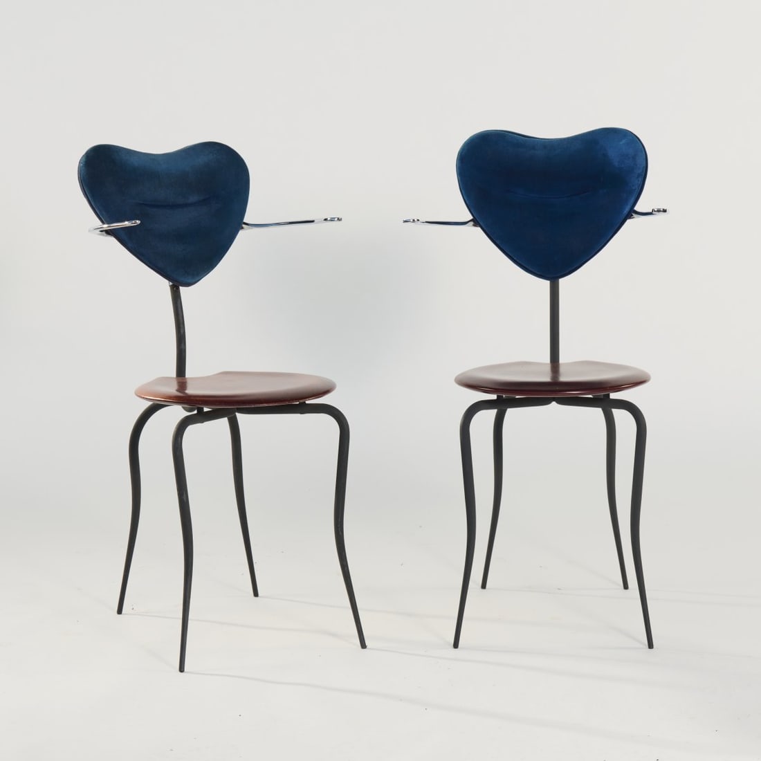 Roberto Lazzeroni, Two 'Little Sister' armchairs, 1992: H. 86 x 44-48 x 54-60 cm. Made by Cidue srl., Atripalda. Cast aluminum, polished, tubular aluminum, coated dark gray, wood stained to mahogany, velvet cover, dark blue. Marked: manufacturer's sticker.
