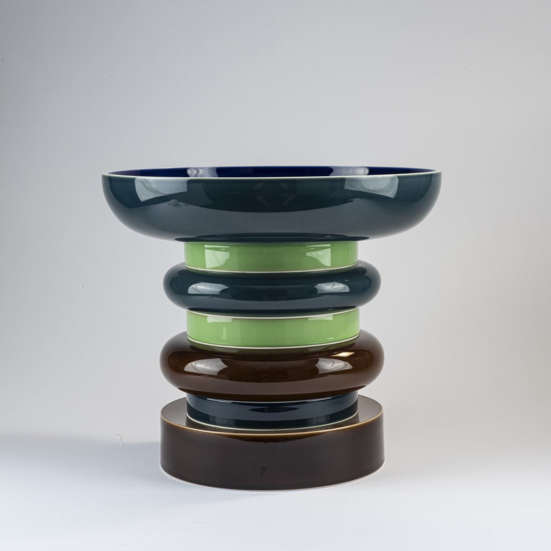 Ettore Sottsass, 'Messaline' centerpiece, 1994: H. 34 cm. Made by Manufacture Nationale de Sevres, in 1994. Porcelain, white, glazed, blue, green and brown underglaze. Marked: manufacturer's mark, designer's facsimile signature, HS-94-PN. Literatur