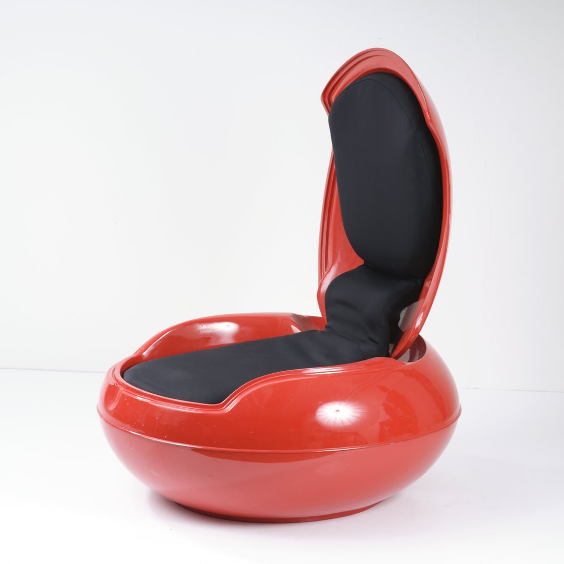 Peter Ghyczy, 'Columbus' egg' chair, 1968: H. 48-103 x 74 x 83 cm. Made by Reuter Product Design GmbH. Polyester, reinforced with Fiberglas, painted red, foam rubber upholstery, black cover. Literature: Fiell, 70s Decorative Art, Cologne 2000